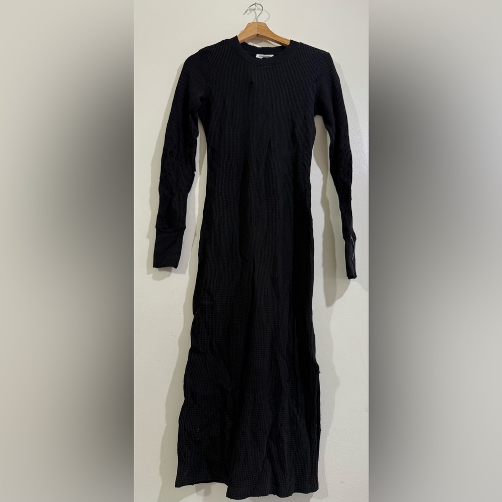 Cotton Citizen Black Ribbed Long-Sleeve The holes are the style of the garment